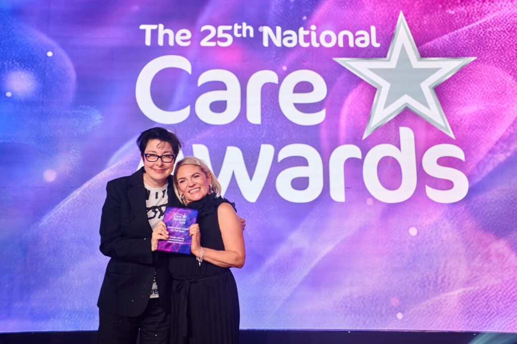 Lakeland Care Senior Carer Ashleigh Harvey receiving Domiciliary Carer of the Year award at the National Care Awards 2025 in London.